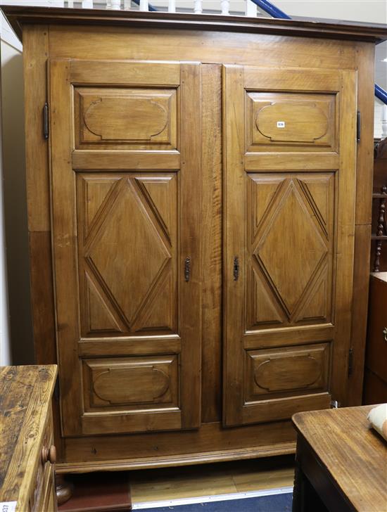 A 19th century French provincial walnut armoire, fitted a pair of lozenge-panelled doors, W.160cm